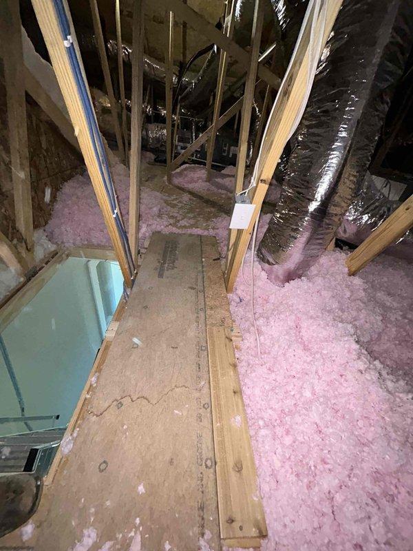 Responded to failed city inspection for dual furnace installation in attic space. Relocated gas shutoff valve to proper position before union connection on flexible gas line, as it was previously installed after the flexible line in violation of code. Secured plywood walkway from attic entrance to equipment platform in both attic spaces to meet inspector requirements. Documented inspector notes and verified all cited items were addressed prior to scheduling final inspection.