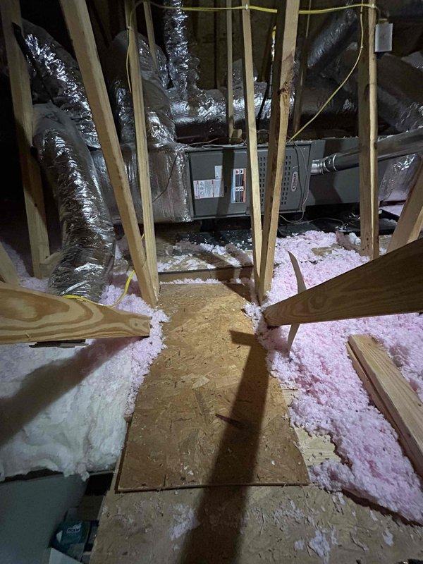 Responded to failed city inspection for dual furnace installation in attic space. Relocated gas shutoff valve to proper position before union connection on flexible gas line, as it was previously installed after the flexible line in violation of code. Secured plywood walkway from attic entrance to equipment platform in both attic spaces to meet inspector requirements. Documented inspector notes and verified all cited items were addressed prior to scheduling final inspection.