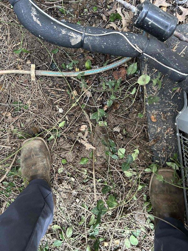 Responded to water leak complaint at basement AC unit. Upon arrival, found active condensate drainage issue with puddle present beneath indoor air handler. Inspected two-year-old system and identified condensate drain line obstruction causing water backup and overflow. Cleared blockage from drain line, verified proper drainage flow, and tested system operation. Inspected drain pan for damage and confirmed structural integrity. Cleaned up standing water and advised proper monitoring of system going forward.
