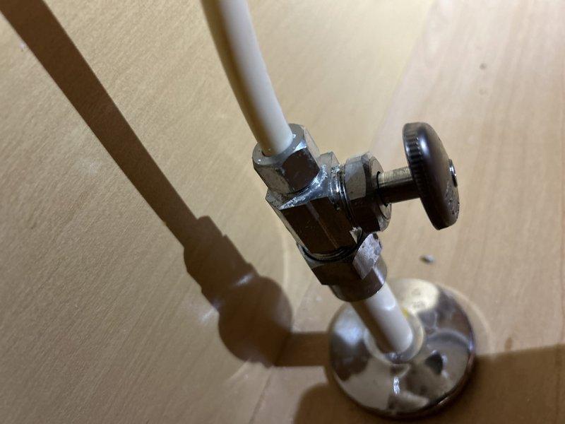 Completed routine plumbing inspection coordinated with HVAC service. Inspected and documented water pressure gauge reading at approximately 250 psi on main supply line, verified proper operation of angle stop valve and supply line connections at fixture location. All components found in working condition with normal wear patterns noted.