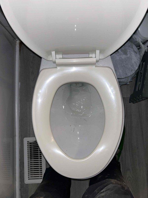 Completed routine plumbing inspection as part of maintenance plan. Inspected bathroom fixtures including toilet, bathtub, tub spout, and drain assembly for proper operation and potential issues. Documented condition of fixtures, noting grout discoloration between wall tiles and minor tile cracking in tub surround area, though all plumbing components functioning properly with no active leaks detected.