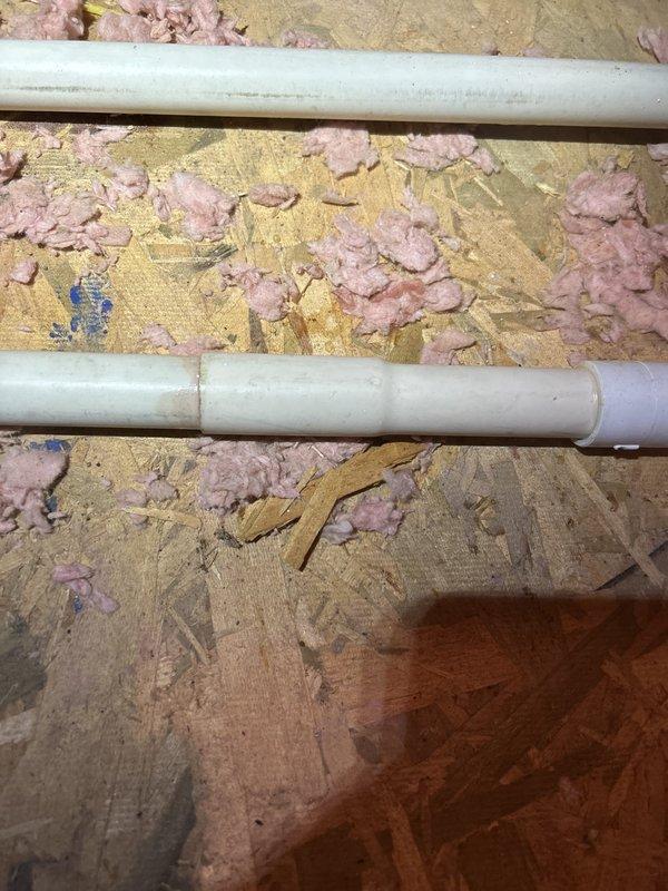Responded to callback for recurring condensate leak in attic HVAC system. Upon inspection, located source of water intrusion at primary drain line connection point where PVC coupling had failed. Reconfigured drain line routing, installed new fittings with proper slope, and verified secondary drain line was clear and functioning. Tested system through complete cooling cycle to confirm proper drainage with no leaks detected.