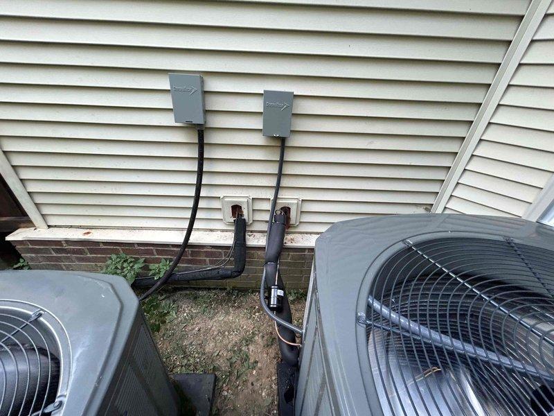 Completed full residential HVAC system installation for first floor heating and cooling. Installed Trane 3-ton heat pump system (model 5TWR4036A1000) rated up to 15.2 SEER2 with matching 3-ton air handler (model 5TEM4B04AC31SA) in attic space. Added Trane 15kW heat kit (model BAYHTR1517BRK) for supplemental heating capacity. Mounted outdoor condenser unit on ground-level pad with proper clearances and installed electrical disconnect box on exterior wall. Ran refrigerant lines and electrical conduit between outdoor and indoor units through exterior wall penetrations. Upgraded existing return air system by enlarging filter grille from 20x25 to 20x30 to improve airflow and system performance. Installed new digital thermostat for precise temperature control. Performed duct cleaning services on first floor ductwork to remove debris and improve indoor air quality. Installed REME Halo air purification system on existing second floor HVAC unit for enhanced air quality throughout home. Complete