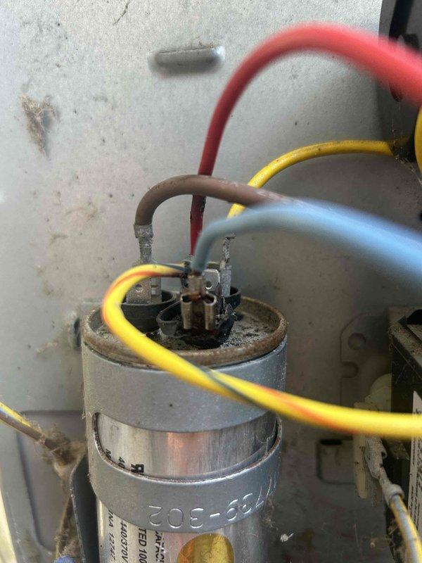 Responded to callback for loud humming noise during system startup. Diagnosed failed run capacitor showing visible deterioration, dirt accumulation, and electrical stress on terminals. Replaced defective capacitor with new component, verified proper wire connections, and tested system operation. Unit now cycles on quietly without abnormal noise, resolving the issue unrelated to previous service call.