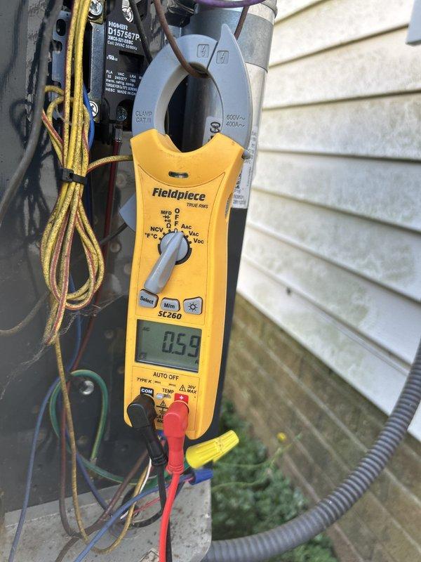 Completed comprehensive Care Plan tune-up on Bryant HVAC system, including inspection of gas furnace and air conditioning components. Verified UV light operation due to property's history of mold growth in ventilation system, checked all electrical connections with amp draw readings showing normal operation at 0.59 amps, and inspected condensate drain lines and ductwork throughout the installation area.