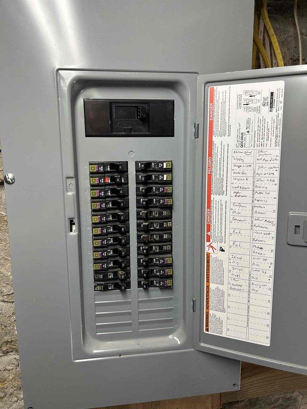 Completed electrical service for car charging station installation in garage with breaker box conveniently located in same space. Assessed existing electrical panel capacity, verified proper circuit availability, and prepared workspace with temporary lighting for safe installation conditions. Successfully integrated charging station circuit into main electrical panel, ensuring proper breaker sizing and code-compliant installation for electric vehicle charging capabilities.