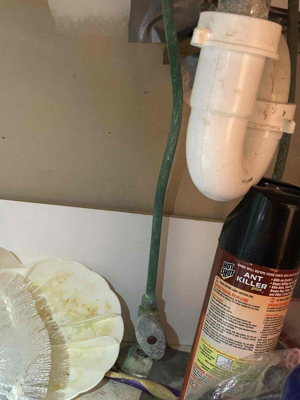 Completed comprehensive plumbing system inspection as part of preventative service agreement, examining all accessible fixtures, supply lines, and drain assemblies. Inspected under-sink plumbing including PVC P-trap configuration and shut-off valve assemblies, noting minor corrosion and mineral deposits on copper supply line connections and valve bodies consistent with normal water exposure over time. All plumbing components found to be functional and intact with no active leaks detected at time of inspection.