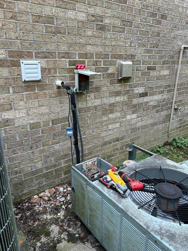 Responded to no cooling complaint on 20-year-old electric Rheem HVAC system with indoor unit located in basement. Performed diagnostic evaluation and determined existing outdoor condenser unit was experiencing overheating issues and system failure. Due to age of equipment and extent of mechanical failure, provided comprehensive replacement estimate for complete system upgrade. Documented existing equipment configuration including outdoor unit placement, electrical connections, refrigerant line routing, and wall-mounted components for replacement planning purposes.