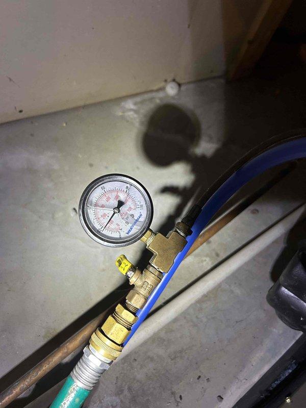 Responded to no cooling call on 3-year-old geothermal water source heat pump displaying error code "83 Low Pressure Lockout 4." Upon arrival, verified system was in lockout mode with no operation and indoor temperature matching setpoint of 77°F. Connected manifold gauge set to service ports and confirmed low refrigerant pressure on system. Inspected GCO36VTRCCET1XX1 model unit in basement location and documented equipment specifications and current operating conditions. Advised customer of low refrigerant charge condition causing pressure switch lockout and provided repair options to restore cooling operation.