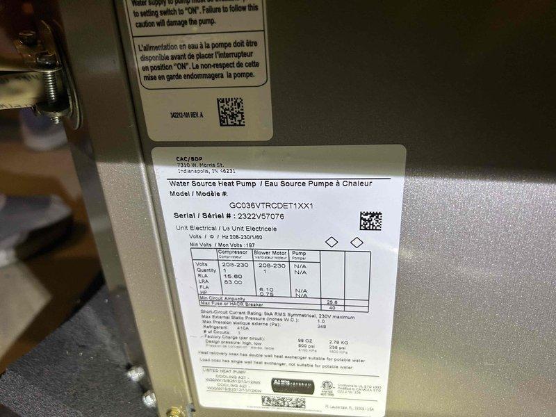 Responded to no cooling call on 3-year-old geothermal water source heat pump displaying error code "83 Low Pressure Lockout 4." Upon arrival, verified system was in lockout mode with no operation and indoor temperature matching setpoint of 77°F. Connected manifold gauge set to service ports and confirmed low refrigerant pressure on system. Inspected GCO36VTRCCET1XX1 model unit in basement location and documented equipment specifications and current operating conditions. Advised customer of low refrigerant charge condition causing pressure switch lockout and provided repair options to restore cooling operation.