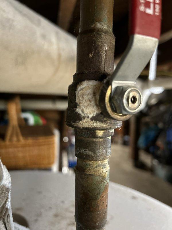 Completed comprehensive plumbing inspection of residential property as part of routine maintenance protocol. Conducted thorough examination of accessible plumbing systems including crawl space utilities and exposed pipe connections. Inspected condition of water supply lines, drainage systems, and pipe joints throughout accessible areas.

During crawl space inspection, documented existing conditions of plumbing infrastructure running through subfloor area. Observed various pipe materials including PVC and metal piping in overhead configuration. Noted presence of moisture indicators and mineral deposits on metal pipe fittings, particularly at connection points showing white crystalline efflorescence buildup consistent with long-term water exposure. Examined corroded pipe joints displaying oxidation and age-related deterioration with brown-gray patina on metal surfaces.

Assessed overall plumbing system integrity and identified areas showing normal wear patterns associated with aging infr