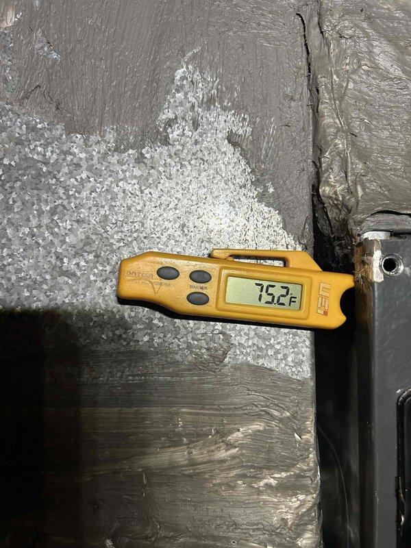 Responded to no cooling complaint on 6-year-old electric HVAC system unable to maintain temperature below 77°F. Performed diagnostic evaluation of indoor unit located in back of home. Temperature measurements revealed supply air at 59°F and return air at 75.2°F, indicating a 16.2°F temperature split, which falls below the standard 18-22°F range for proper cooling operation. System requires further evaluation of refrigerant charge, airflow restrictions, or potential compressor efficiency issues to restore adequate cooling capacity.