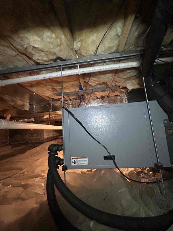 Responded to callback for loud operational noise on recently installed HVAC system. Upon arrival, performed comprehensive inspection of air handler, furnace, and associated ductwork in basement mechanical area. Investigated noise complaint by running system through complete heating and cooling cycles while monitoring all components. Inspected mounting hardware, refrigerant lines, ductwork connections, and condensate pump assembly for loose fittings, vibration issues, or installation defects. Verified proper securing of copper refrigerant lines and mounting brackets. Checked air handler blower assembly and motor mounts for potential sources of noise transmission. Examined flexible ductwork connections and metal duct supports for resonance issues. All equipment found to be properly installed with secure mounting and appropriate vibration isolation. System operating within normal parameters with no abnormal sounds detected during inspection.