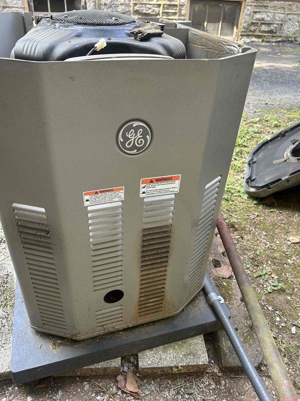 Completed routine maintenance inspection on GE standby generator unit. Documented current equipment condition through comprehensive photography of generator housing, internal engine components including air filter assembly, transfer switch location, electrical conduit routing, and mounting configuration. Captured detailed measurements and installation specifications as requested for potential future equipment replacement evaluation.