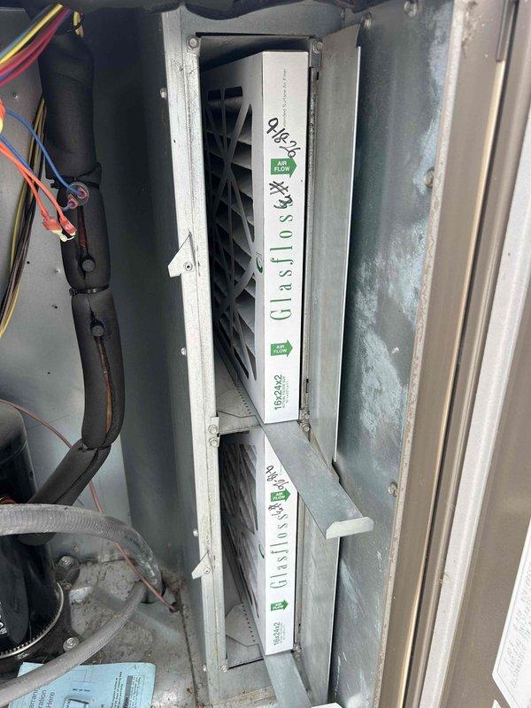 Completed scheduled maintenance visit on three commercial rooftop units (RTU 1 - front left, RTU 2 - front right, RTU 3 - back storeroom) as part of planned service agreement. Performed comprehensive inspection of all units, replaced air filters with (4) 16x24x2 and (8) 20x24x2 filters as specified, and verified proper airflow direction during installation. Noted belts A51 and A54 are on will call for annual replacement, documented equipment tag information and current operating conditions with photographs, and completed required maintenance forms with onsite manager sign-off.