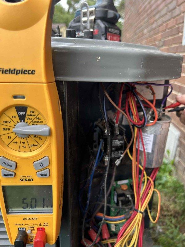 Completed routine maintenance on a 9-year-old heat pump system with air handler located in attic. Performed electrical diagnostics using multimeter to verify proper voltage and system operation at outdoor unit. Inspected and serviced electrical connections, contactors, and control wiring in condensing unit junction box to ensure safe and efficient performance.