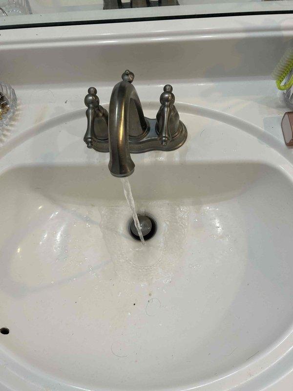 Completed routine plumbing inspection as part of preventative service agreement. Inspected kitchen sink plumbing system including garbage disposal unit, mounting assembly, discharge connections, and drain lines for proper operation and potential leaks. Evaluated bathroom sink faucet assembly and tested water flow to verify proper function of hot and cold water supply lines and fixture operation. All components found to be functioning within normal parameters with no immediate repairs required.