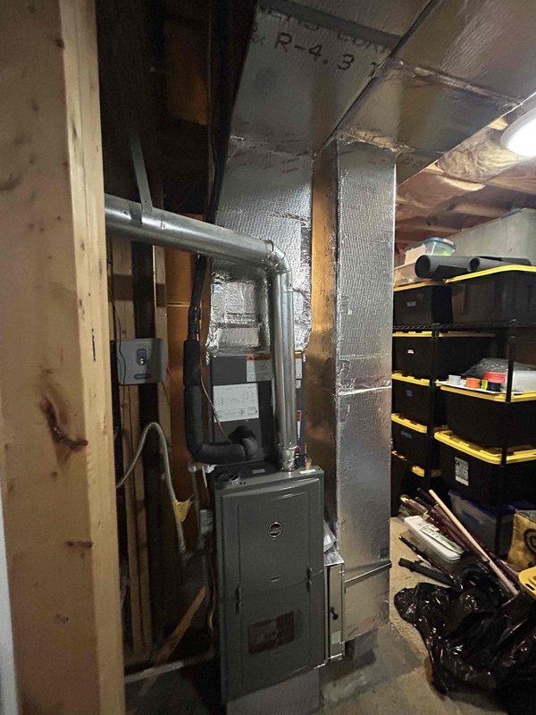 Completed full HVAC system installation for first floor residential application including RUUD 75K BTU 80% gas furnace (model R801T0754A17UHSNAS), RUUD 2.5 ton evaporator coil (model RCFY3617STANMC), and RUUD 2.5 ton 14.3 SEER2 air conditioning condenser unit (model RA14AY30AJ1NALHP). Removed and disposed of existing equipment, installed new outdoor unit on concrete pad with electrical disconnect box and whip kit, ran insulated refrigerant lines with filter drier, installed evaporator coil with transition to existing ductwork, and added SS2 coil drain safety water sensor. Obtained applicable permits, tested all system operations for proper functionality, and established care plan coverage for newly installed first floor system.