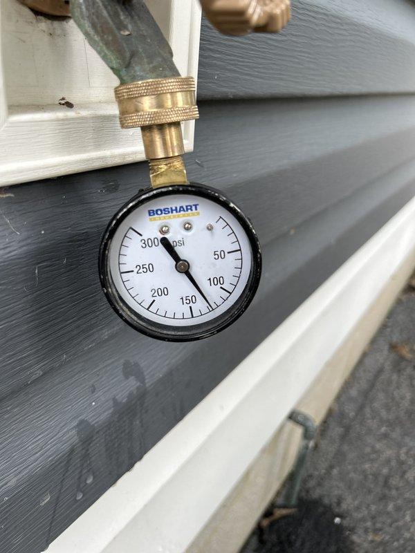 Completed routine plumbing inspection as part of scheduled preventative maintenance service. Inspected bathroom vanity plumbing including PVC P-trap assembly, black vertical drain pipe, and flexible braided stainless steel supply lines, confirming all connections were secure and functioning properly with no visible leaks. Verified exterior water pressure gauge mounted on brass fitting, noting gauge reading at approximately 0 psi at time of inspection. All accessible plumbing components were visually examined and found to be in satisfactory operating condition.