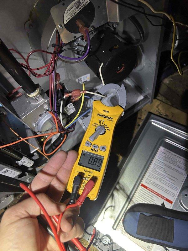 Completed comprehensive AC tune-up and preventive maintenance on a five-year-old split HVAC system with furnace located in crawlspace and air handler in attic. Performed electrical diagnostics using multimeter to verify proper voltage and amperage readings at blower motor, gas valve assembly, and control board connections. Inspected all internal wiring connections including red, purple, orange, yellow, white, and black wire terminals for secure contact and signs of wear. Tested and calibrated Honeywell Home ProSeries digital thermostat, confirmed cooling mode operation set at 73 degrees with fan on auto mode and verified proper communication between thermostat and system. All equipment operating within manufacturer specifications with no issues identified during inspection.