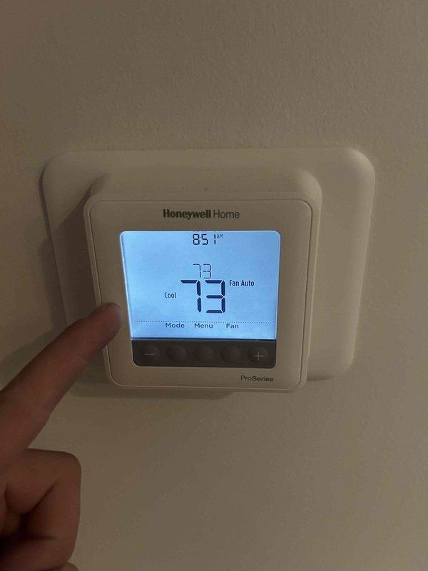 Completed comprehensive AC tune-up and preventive maintenance on a five-year-old split HVAC system with furnace located in crawlspace and air handler in attic. Performed electrical diagnostics using multimeter to verify proper voltage and amperage readings at blower motor, gas valve assembly, and control board connections. Inspected all internal wiring connections including red, purple, orange, yellow, white, and black wire terminals for secure contact and signs of wear. Tested and calibrated Honeywell Home ProSeries digital thermostat, confirmed cooling mode operation set at 73 degrees with fan on auto mode and verified proper communication between thermostat and system. All equipment operating within manufacturer specifications with no issues identified during inspection.