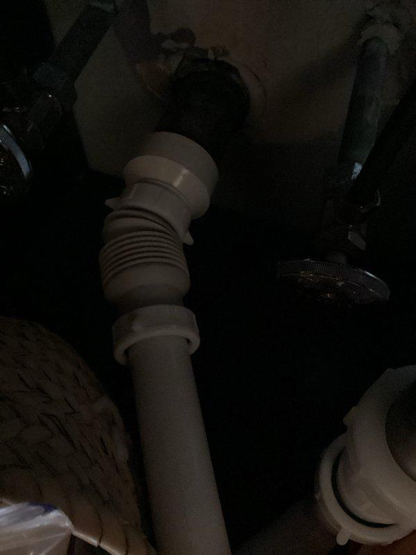 Completed comprehensive plumbing inspection of under-sink fixtures and drainage system. Examined supply line connections, shut-off valves, flexible hoses, PVC drain assembly with threaded fittings, and verified proper installation of all plumbing components with no leaks or deficiencies observed at time of inspection.