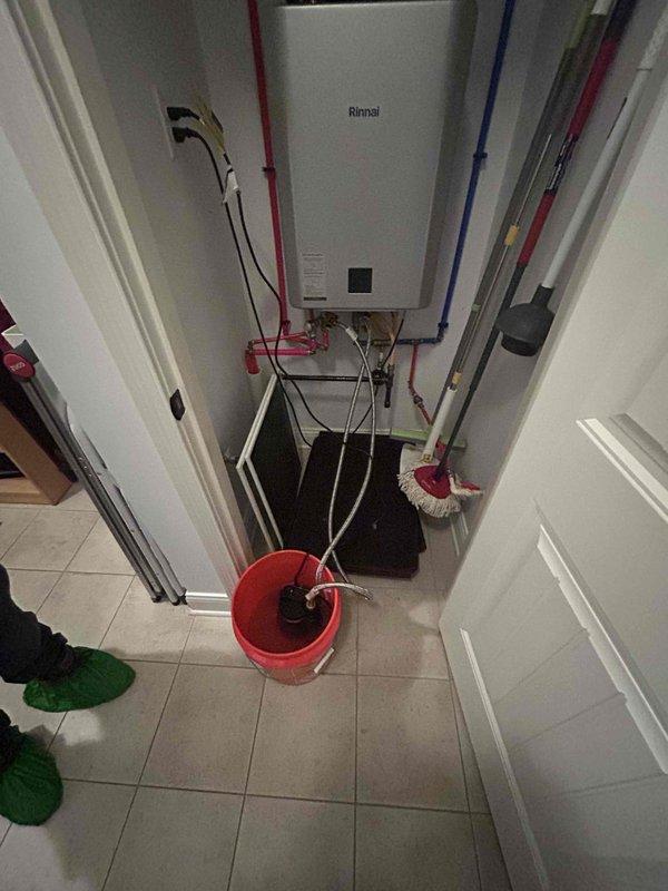 Performed routine maintenance flush on a 2-year-old Rinnai gas tankless water heater located in the utility room. Isolated the unit using the installed shut-off valves on the inlet and outlet PEX lines, connected flushing equipment, and circulated descaling solution through the heat exchanger to remove mineral buildup and sediment accumulation. Verified proper operation of the unit upon completion, confirmed temperature display functionality, and ensured all connections were secure with no leaks detected.