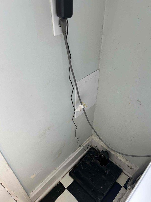 Responded to electrical service call for outlet work in interior utility space. Upon arrival, assessed existing electrical infrastructure in area showing significant wall damage and deterioration. Evaluated exposed wiring and existing outlet configurations on damaged drywall surfaces. Documented pre-existing conditions including compromised wall surfaces, exposed conduit, and deteriorated flooring materials that required consideration for safe electrical installation. Verified electrical connections and mounting locations for outlet installations, ensuring proper clearances and code compliance despite challenging wall conditions. Completed photographic documentation of work area before and during service for quality assurance and safety records.
