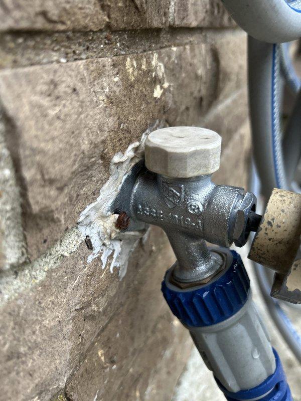 Responded to plumbing preventive service appointment for tanked water heater maintenance. Upon arrival, conducted visual inspection of water heater and associated plumbing components. Observed significant mineral buildup and crystalline deposits on drain valve assembly, indicating hard water conditions and extended service interval. The white chalky accumulation was present on the valve body and surrounding connections, consistent with calcium and magnesium precipitation.

Per service agreement specifications, no flush procedure was performed during this visit as indicated in the recurring maintenance schedule. Documented existing conditions through photographic evidence, capturing the mineral deposits on the drain valve mechanism and deteriorated sealant material at pipe connections. The flexible hose connection showed signs of aging with compromised sealing compound exhibiting flaking and crumbling texture around the junction points.

All observations recorded for maintenance history