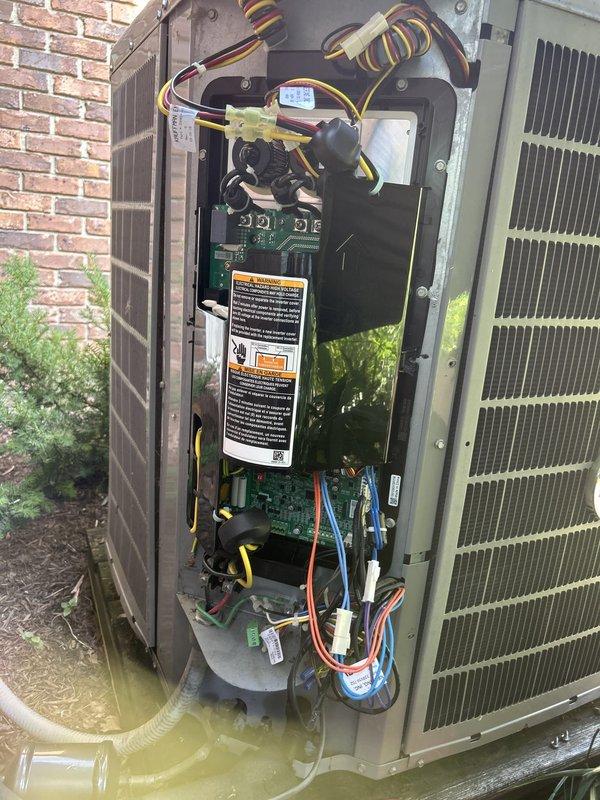 Responded to service call for outdoor HVAC unit requiring component replacement. Diagnosed failed inverter board kit and control board, both covered under parts warranty. Customer declined authorization to proceed with repair at time of service visit and requested invoice be mailed for review. Documented internal unit components showing circuit board assembly, electrical connections, and wiring harnesses. Measured and recorded operational parameters using digital diagnostic equipment, with temperature readings indicating system performance issues. Labor charges for replacement work explained as not covered under existing warranty terms. Awaiting customer approval and payment before scheduling return visit to complete inverter board kit and control board installation.