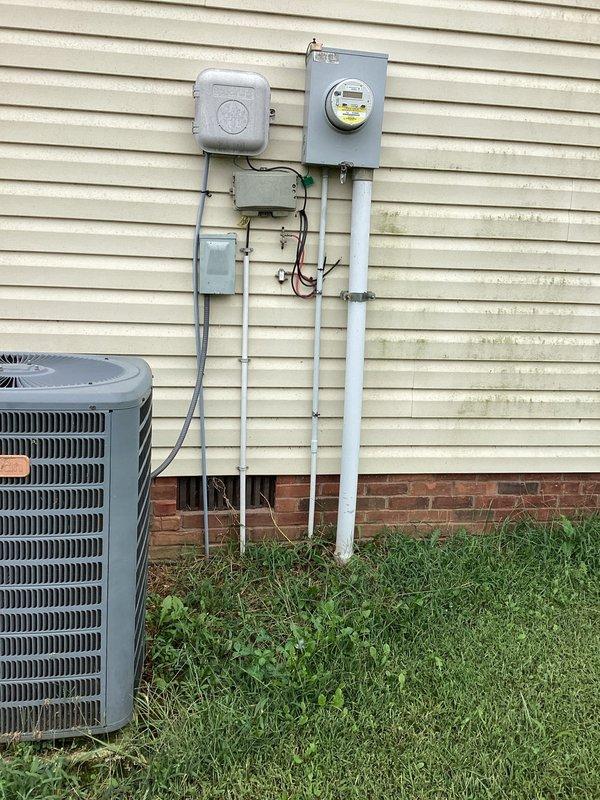 Completed electrical estimate for running power from existing residential service panel to new barn structure located approximately 150-200 feet from main house. Assessed current electrical service capacity at main dwelling, which includes 200-amp meter base with weatherproof disconnect and properly grounded service entrance. Evaluated optimal routing path across property from house-mounted service equipment to barn location, accounting for underground conduit burial requirements and clearance specifications. Determined wire gauge requirements and conduit sizing based on anticipated barn electrical load and voltage drop calculations over distance. Specified materials including appropriate AWG copper conductors, PVC conduit for underground installation, weatherproof junction boxes, and barn-side sub-panel with adequate circuit capacity for lighting, receptacles, and potential equipment loads.