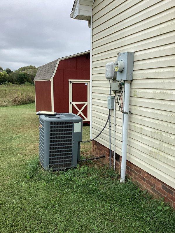 Completed electrical estimate for running power from existing residential service panel to new barn structure located approximately 150-200 feet from main house. Assessed current electrical service capacity at main dwelling, which includes 200-amp meter base with weatherproof disconnect and properly grounded service entrance. Evaluated optimal routing path across property from house-mounted service equipment to barn location, accounting for underground conduit burial requirements and clearance specifications. Determined wire gauge requirements and conduit sizing based on anticipated barn electrical load and voltage drop calculations over distance. Specified materials including appropriate AWG copper conductors, PVC conduit for underground installation, weatherproof junction boxes, and barn-side sub-panel with adequate circuit capacity for lighting, receptacles, and potential equipment loads.