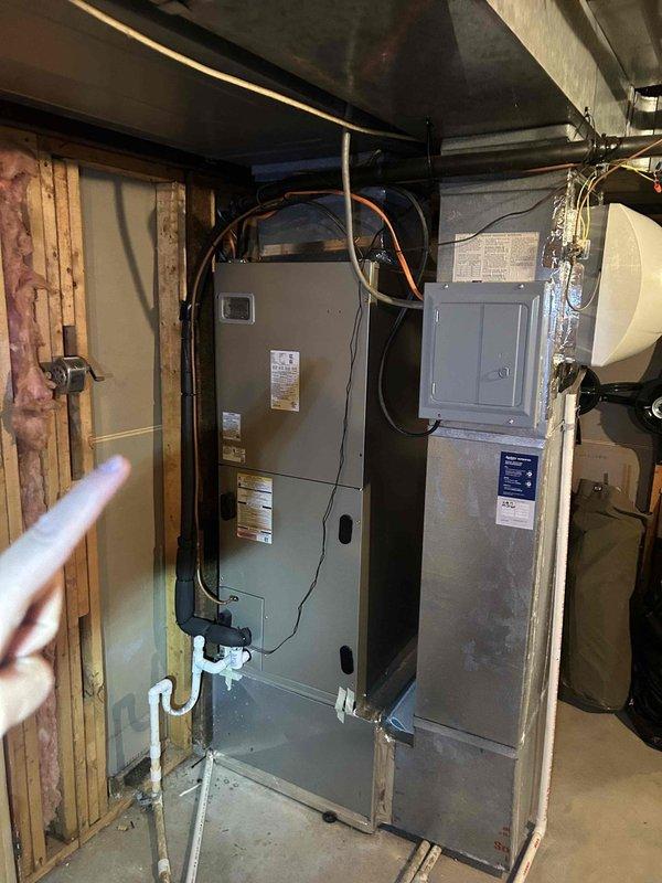 Completed comprehensive maintenance tune-up on dual-zone HVAC system including two heat pumps, two air handlers, and humidifier located in attic and basement areas. Performed temperature diagnostics with readings of 123.1°F on supply ductwork, replaced 20x20x1 filters at both locations, inspected electrical connections and conduit routing, verified refrigerant line integrity, checked condensate drain system and PVC drainage components, and documented equipment condition with baseline measurements for both zones.