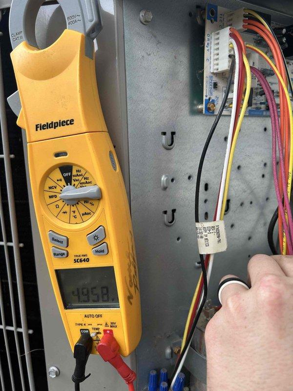 Completed Care Plan tune-up on heat pump and air handler system located in closet. Performed comprehensive electrical diagnostics using clamp meter, recording voltage readings of 495.8V and 335.9V at control panel terminals. Inspected and tested capacitor, verifying proper electrical connections and system operation. Evaluated all wiring connections at terminal blocks and control board. Customer provided filters (16x20x1) as previously arranged. System operating within normal parameters upon completion of maintenance service.