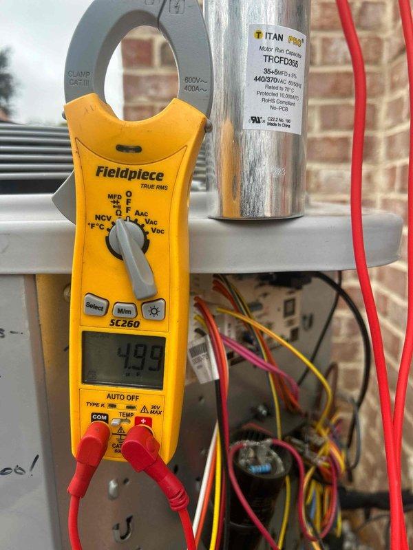 Completed comprehensive Care Plan tune-up on multi-system HVAC installation including two gas furnace/AC units, three heat pump/air handler units, and humidifier located in attic, laundry room, and basement. Performed electrical diagnostics using clamp meter to verify capacitor performance on TITAN PRO TRCFD355 capacitor rated at 440/370V AC, with readings measuring 493-499 MFD within acceptable operating parameters. Replaced all air filters per plan specifications including (2) 20x20x1, (1) 14x20x1, and (1) 16x20x4 filters across all units, inspected electrical connections and wiring throughout all systems, and verified proper operation of all equipment with no deficiencies noted.