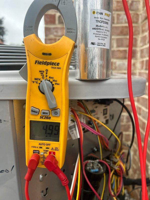 Completed comprehensive Care Plan tune-up on multi-system HVAC installation including two gas furnace/AC units, three heat pump/air handler units, and humidifier located in attic, laundry room, and basement. Performed electrical diagnostics using clamp meter to verify capacitor performance on TITAN PRO TRCFD355 capacitor rated at 440/370V AC, with readings measuring 493-499 MFD within acceptable operating parameters. Replaced all air filters per plan specifications including (2) 20x20x1, (1) 14x20x1, and (1) 16x20x4 filters across all units, inspected electrical connections and wiring throughout all systems, and verified proper operation of all equipment with no deficiencies noted.
