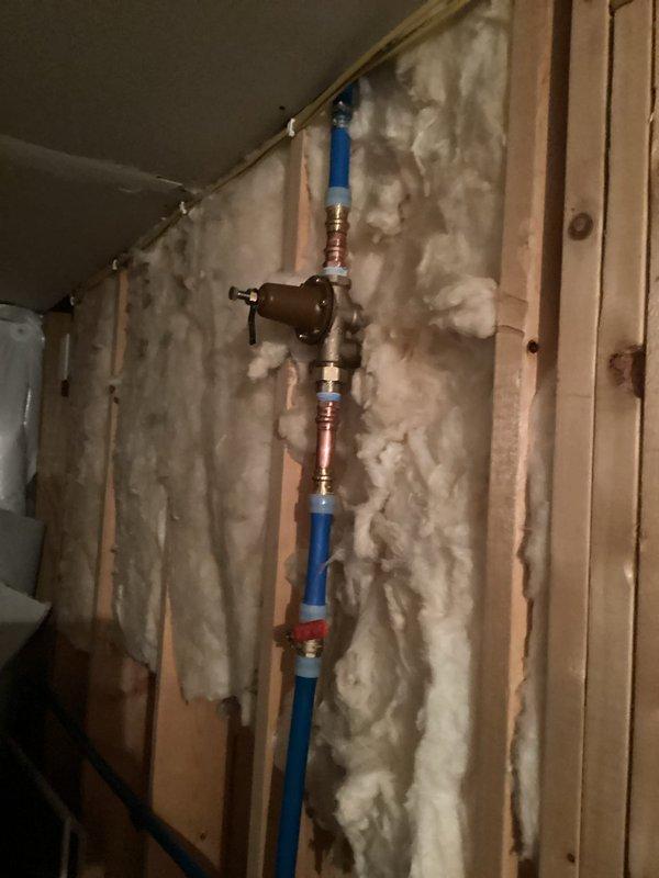 Responded to plumbing service call and successfully replaced defective fill valve assembly. Accessed plumbing system through interior wall cavity where PEX supply line and shut-off valve were exposed during renovation work. Completed installation with proper fittings and verified system operation. Tested water pressure at exterior hose bib using calibrated pressure gauge to ensure proper system performance following repair.