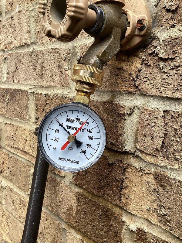 Responded to plumbing service call and successfully replaced defective fill valve assembly. Accessed plumbing system through interior wall cavity where PEX supply line and shut-off valve were exposed during renovation work. Completed installation with proper fittings and verified system operation. Tested water pressure at exterior hose bib using calibrated pressure gauge to ensure proper system performance following repair.