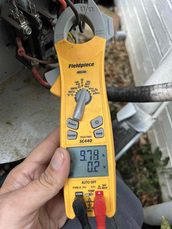 Completed comprehensive care plan tune-up for 8-year-old HVAC system with furnace located in attic. Performed electrical diagnostics on outdoor condensing unit, measuring compressor amperage at 97.8A and verifying proper voltage at 0.2V differential using clamp meter. Conducted static pressure testing reading 634 pascals to assess system airflow and duct performance. All electrical connections at contactor inspected and verified secure. System operating within normal parameters upon completion of maintenance.