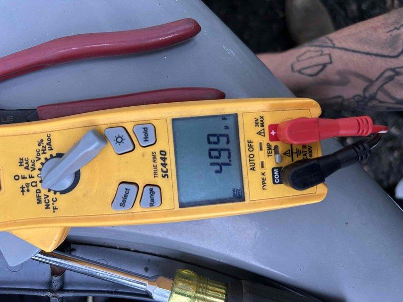 Completed comprehensive care plan tune-up for 8-year-old HVAC system with furnace located in attic. Performed electrical diagnostics on outdoor condensing unit, measuring compressor amperage at 97.8A and verifying proper voltage at 0.2V differential using clamp meter. Conducted static pressure testing reading 634 pascals to assess system airflow and duct performance. All electrical connections at contactor inspected and verified secure. System operating within normal parameters upon completion of maintenance.