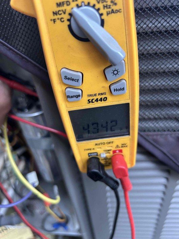 Completed preventive maintenance tune-up on air conditioning and gas furnace system located in basement. Performed comprehensive system diagnostics using calibrated test equipment, recording voltage readings of 39.33V and capacitance measurement of 4342 MFD to verify proper electrical component operation. Inspected all electrical connections, tested system controls, and evaluated overall equipment performance to ensure optimal efficiency and reliability for continued operation.