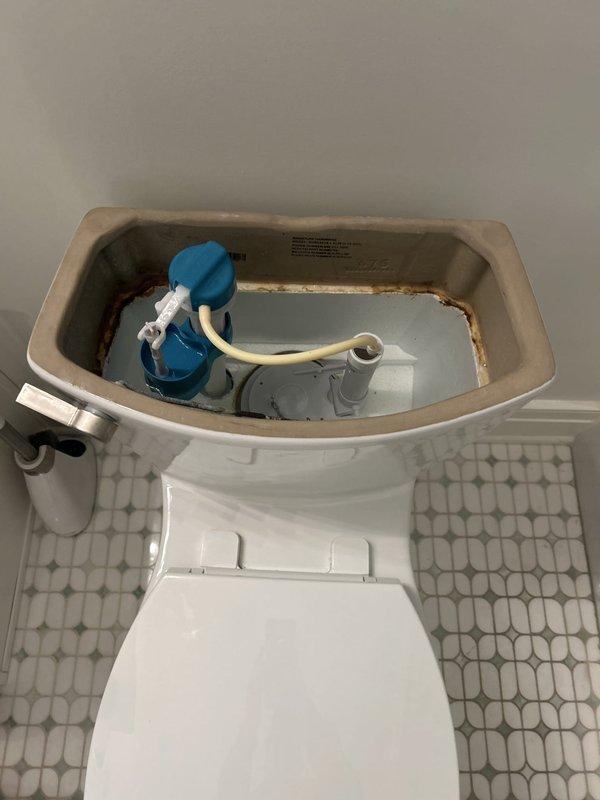 Responded to service call for two tankless water heaters experiencing intermittent shutdown issues and extended reboot times. Inspected both units, documented current installation with color-coded PEX supply lines and venting configuration. Assessed hot water delivery delay to kitchen sink and evaluated whole-home water pressure concerns for future remediation recommendations. Repaired leaking toilet on first floor by inspecting tank components, identifying deteriorated flush valve assembly with visible corrosion staining, and performing necessary repairs to restore proper operation and eliminate water loss.