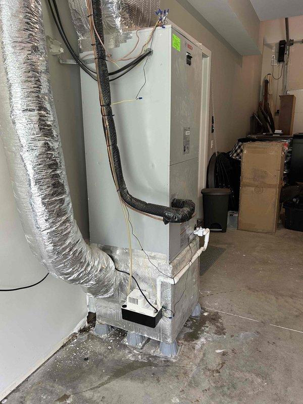 Responded to repeat water leak issue at Bosch air handler unit with standing water in filter box and active leaking. Inspected unit, ductwork connections, and condensate drainage system. Identified clogged condensate drain line causing water backup into filter compartment. Cleared obstruction from drain line, tested condensate pump operation, and verified proper drainage flow to prevent future water accumulation in unit.
