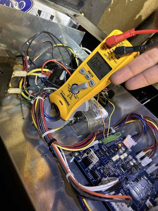 Completed preventive maintenance on Club Duo geothermal split system. Accessed attic-mounted air handler, performed electrical diagnostics on control board using digital multimeter with readings at 10.5 volts, and verified proper operation of all system components. All equipment tested and confirmed operational within manufacturer specifications.