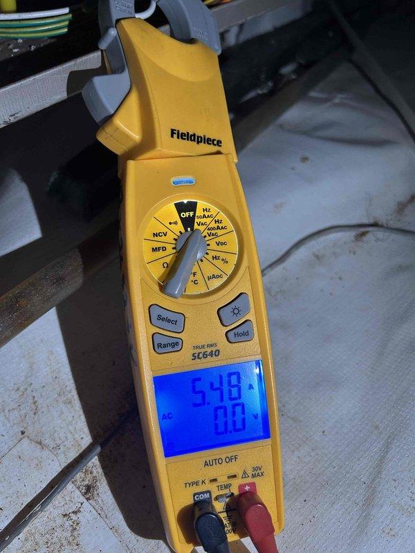 Performed routine HVAC maintenance on ground floor air conditioning equipment located in crawlspace. Conducted electrical diagnostics and measurements using clamp meter, recording amperage draw of 4.87A and voltage readings to verify proper system operation. Customer maintains their own 16x25x4 filter supply separately.