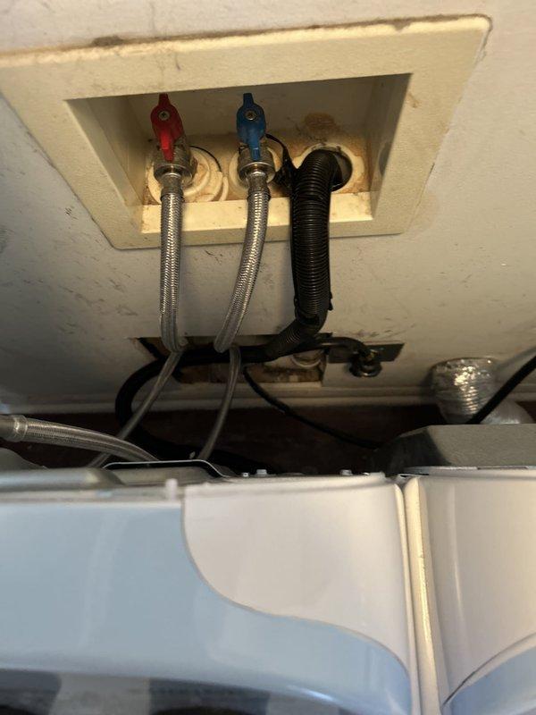 Responded to main drain cleanout service call and performed thorough assessment of plumbing system. Accessed ceiling-mounted plumbing connections above toilet installation, inspecting braided stainless steel flexible supply lines with shutoff valves and associated drainage components. Successfully cleared main drain line obstruction and verified proper water flow throughout the system. Tested all connections for leaks and confirmed restoration of full drainage capacity.