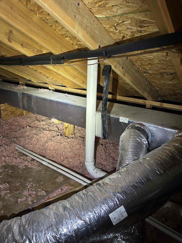 Completed routine cooling maintenance on four HVAC systems including one heat pump with air handler, two air conditioning units, and one gas furnace. Systems consist of a 9-year-old Bryant unit and an 18-year-old Goodman unit, both operating properly at time of service. Performed comprehensive AC tune-up procedures on all equipment, including inspection of attic-mounted air handler with flexible ductwork system, verification of proper airflow through insulated supply ducts, and temperature differential testing. Measured supply air temperature at 85.5°F at air handler unit. Verified proper operation of all mechanical components, checked refrigerant levels, inspected electrical connections, and confirmed system performance meets manufacturer specifications. All four systems tested and left in proper working condition with no deficiencies noted.