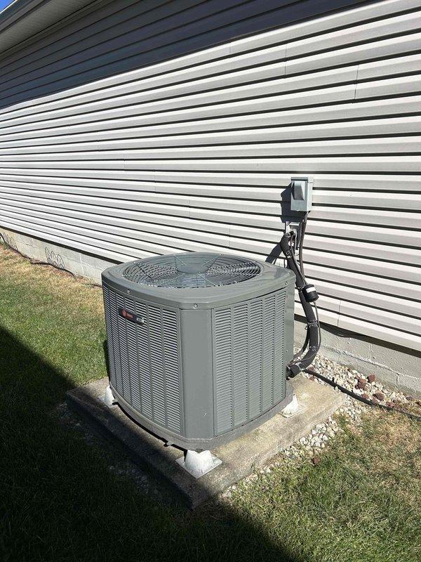 Completed preventive maintenance tune-up on heat pump and air handler system located in attic as part of care plan service. Performed comprehensive inspection of outdoor condenser unit and indoor components, tested electrical parameters with clamp meter showing system operating within normal specifications, and documented equipment condition through photos. Customer provided filters for replacement during service visit.