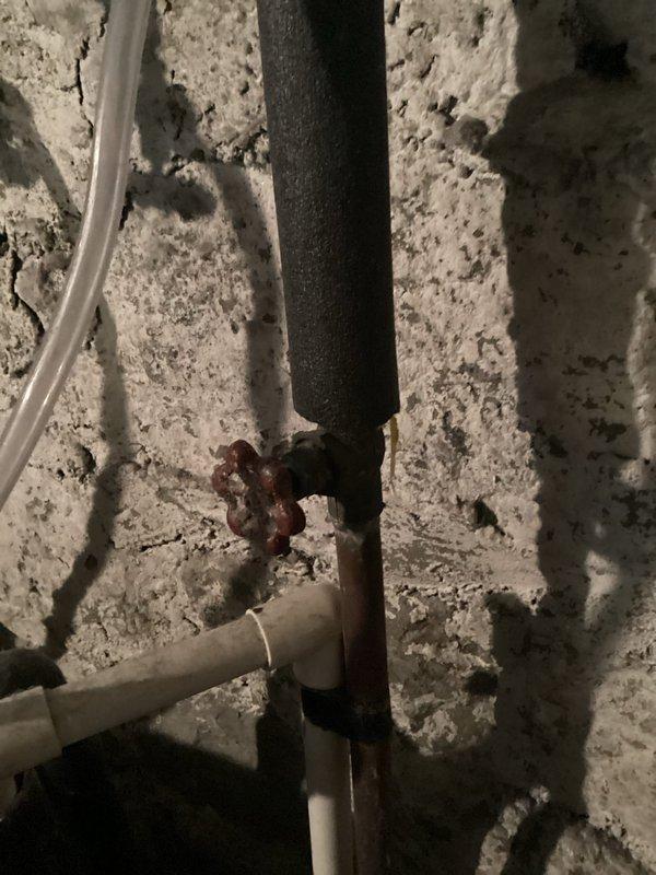 Responded to service call for leaking toilet on upper level. Upon inspection, identified corroded pipe fittings and connections in the bathroom plumbing system causing water seepage. Documented existing conditions including deteriorated metal connectors with significant rust buildup at junction points and aging pipe infrastructure requiring attention to prevent further water damage.