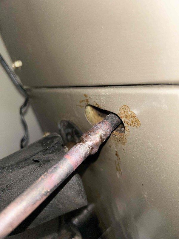 Repaired failed braze joint on refrigerant line and addressed condensate drain line issue on HVAC system. Brazed copper connection was re-sealed, system was evacuated and recharged with refrigerant to manufacturer specifications, and drain line was cleared and secured to restore proper condensate removal.
